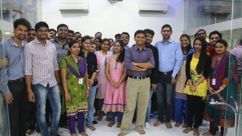 Ergode team members standing together for a group photo in an office